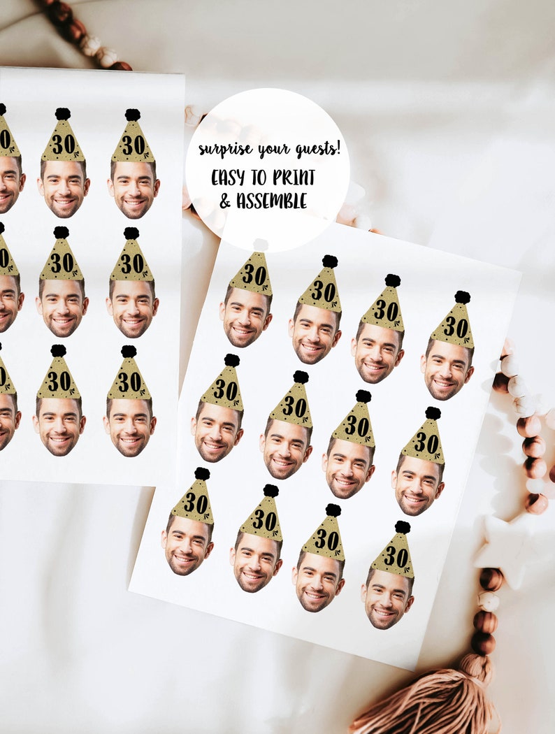 May include: A sheet of printable party hat stickers with a gold and black design. Each hat features a face cutout and the number "30" in black text. The text "surprise your guests! EASY TO PRINT & ASSEMBLE" is printed on the sheet.