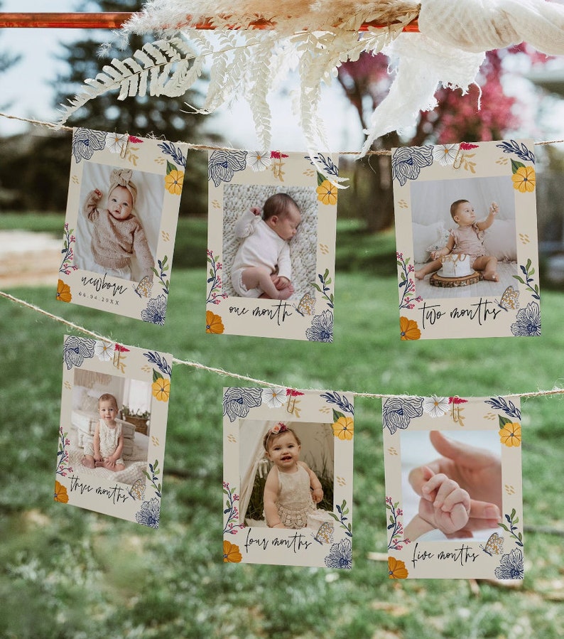 Puede incluir: Un conjunto de seis tarjetas de fotos con bordes florales y los hitos mensuales de un beb&eacute;. Las tarjetas est&aacute;n atadas con un cordel y muestran fotos de un beb&eacute; a diferentes edades. Las tarjetas est&aacute;n decoradas con flores y hojas coloridas. El texto en las tarjetas dice "reci&eacute;n nacido", "un mes", "dos meses", "tres meses", "cuatro meses" y "cinco meses".