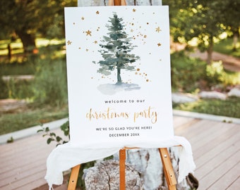 May include: A white sign on a wooden easel with a watercolor Christmas tree and gold stars. The sign reads "Welcome to our Christmas Party" in gold script, with additional text below. A white cloth drapes the easel.