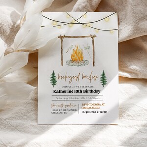 May include: A white invitation card with a watercolor illustration of a campfire with string lights above. The text reads "Backyard Bonfire" and "Join us as we celebrate Katherine 10th Birthday" with the date and time. The invitation also includes the address and RSVP information.