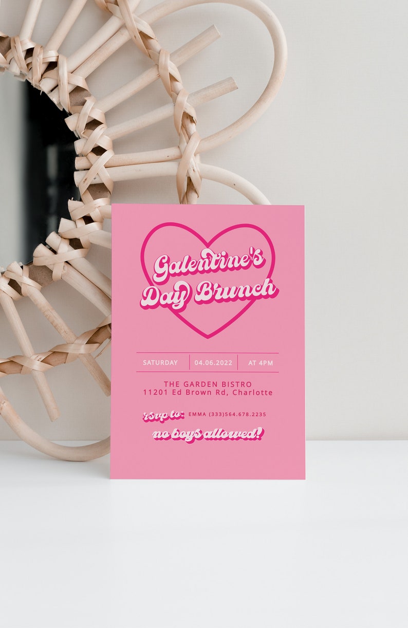 May include: Pink invitation card with a heart-shaped graphic that says "Galentine's Day Brunch". The card includes details for the event, including the date, time, location, and RSVP information. The text "no boys allowed!" is written in a playful font.