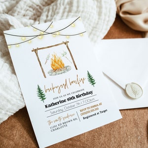 May include: A white invitation card with a watercolor illustration of a campfire with marshmallows roasting over the flames. The text on the card reads "backyard bonfire" and "Katherine 10th Birthday".