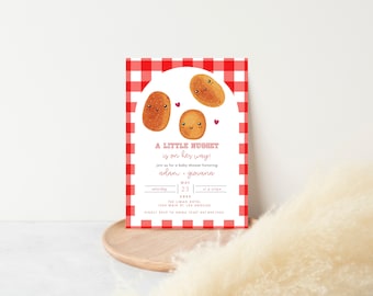 May include: Baby shower invitation with a red and white gingham border. The invitation features three cartoon nuggets with smiling faces and the text "A Little Nugget is on her way!" The date is May 23.