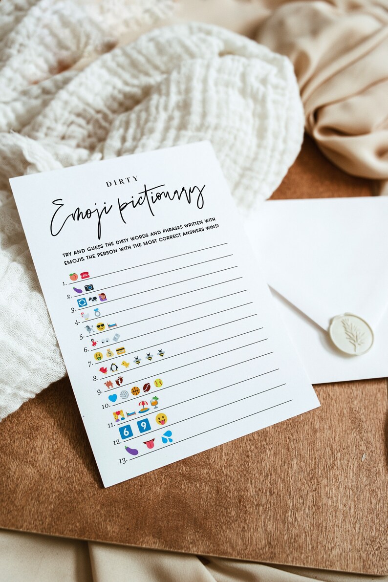 May include: A white printable game card with the title "Dirty Emoji Pictionary". The card has instructions to try and guess the dirty words and phrases written with emojis. The person with the most correct answers wins. The card has 13 lines with emojis on each line.