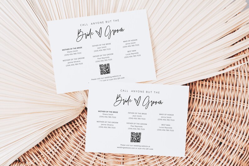 May include: Two white cards with the text "Call anyone but the Bride & Groom" printed in black. Each card has a list of names and phone numbers for the wedding party, including the mother of the bride, father of the bride, mother of the groom, father of the groom, maid of honour, and best man. Each card also has a QR code with the text "Please visit our wedding website at weddingwebsite.com or scan this QR code".