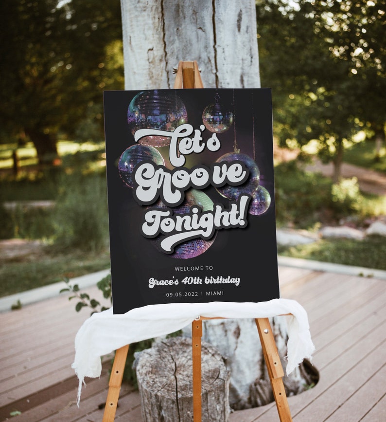 May include: A black welcome sign with a disco ball theme. The sign says "Let's Groove Tonight!" and "Welcome to Grace's 40th birthday 09.05.2022 | Miami".