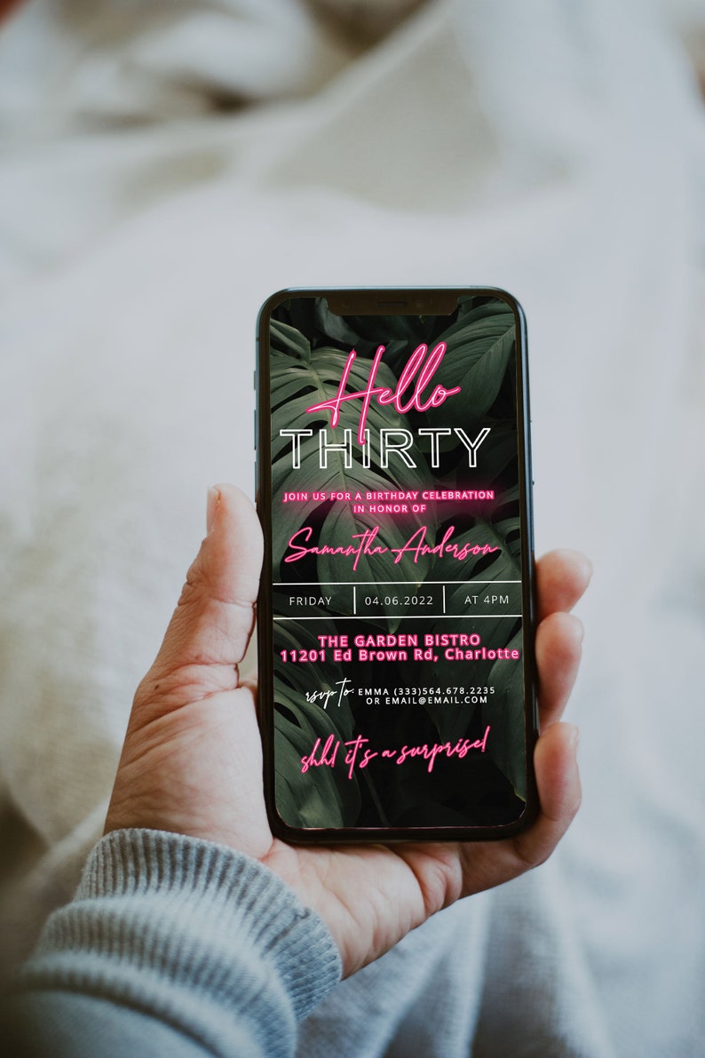 May include: A smartphone screen displaying a birthday party invitation for Samantha Anderson's 30th birthday. The invitation is decorated with tropical leaves and neon pink text that reads "Hello Thirty". The party is scheduled for Friday, 04.06.2022 at 4 PM at The Garden Bistro, 11201 Ed Brown Rd, Charlotte. RSVP to Emma at (333) 564.678.2235 or email@email.com. The text "shh it's a surprise" is also included in neon pink.