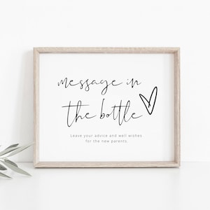 Op de afbeelding: Een ingelijst bord met de tekst "Message in the bottle" en een hartje. De tekst eronder luidt "Laat je advies en goede wensen achter voor de nieuwe ouders."