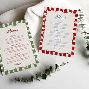 Pode incluir: Dois cartões de menu imprimíveis com uma borda listrada vermelha e branca e uma borda listrada verde e branca. O texto nos cartões diz "Menu" com os títulos "Entradas", "Prato principal" e "Sobremesa".