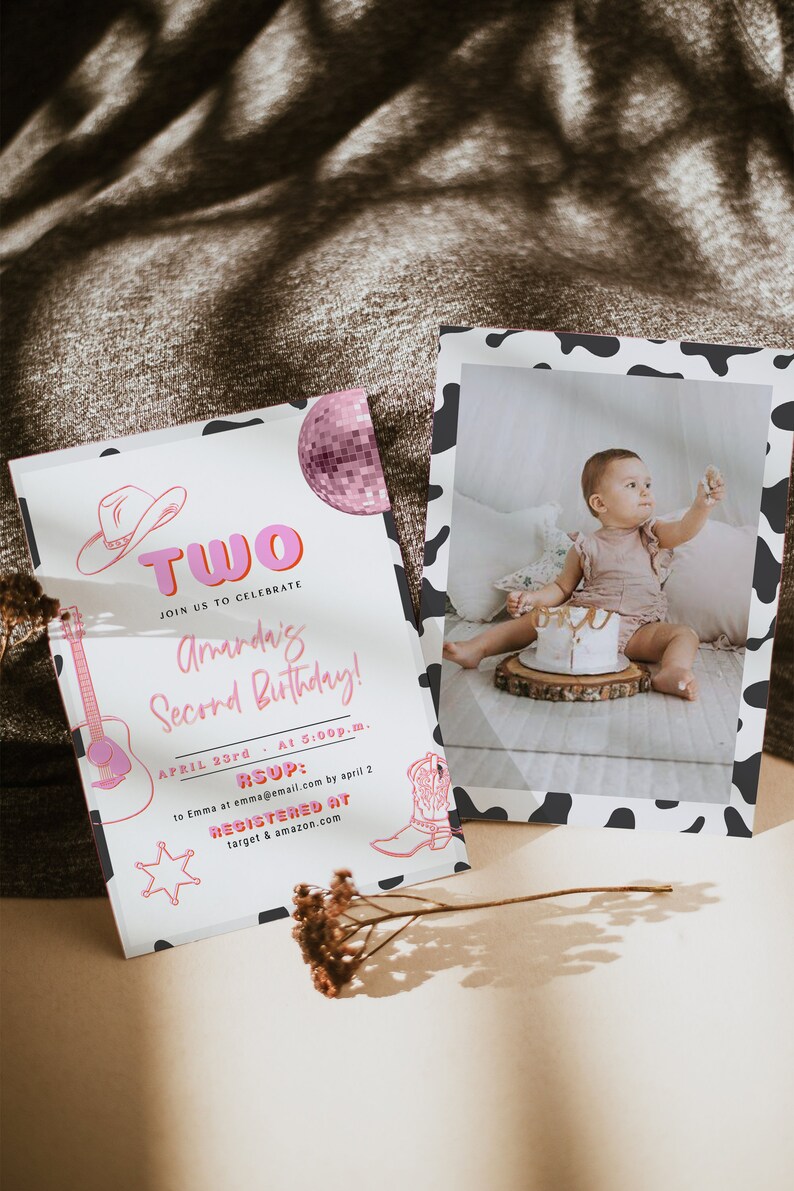 May include: A pink and white birthday invitation with a cow print border. The invitation says "Two" in pink letters and "Join us to celebrate Amanda's Second Birthday!" The invitation also includes a pink disco ball, a cowboy hat, a guitar, a cowboy boot, and a sheriff's star. The invitation says "April 23rd at 5:00p.m." and "RSVP: to Emma at emma@email.com by April 2". The invitation also says "Registered at target & amazon.com".