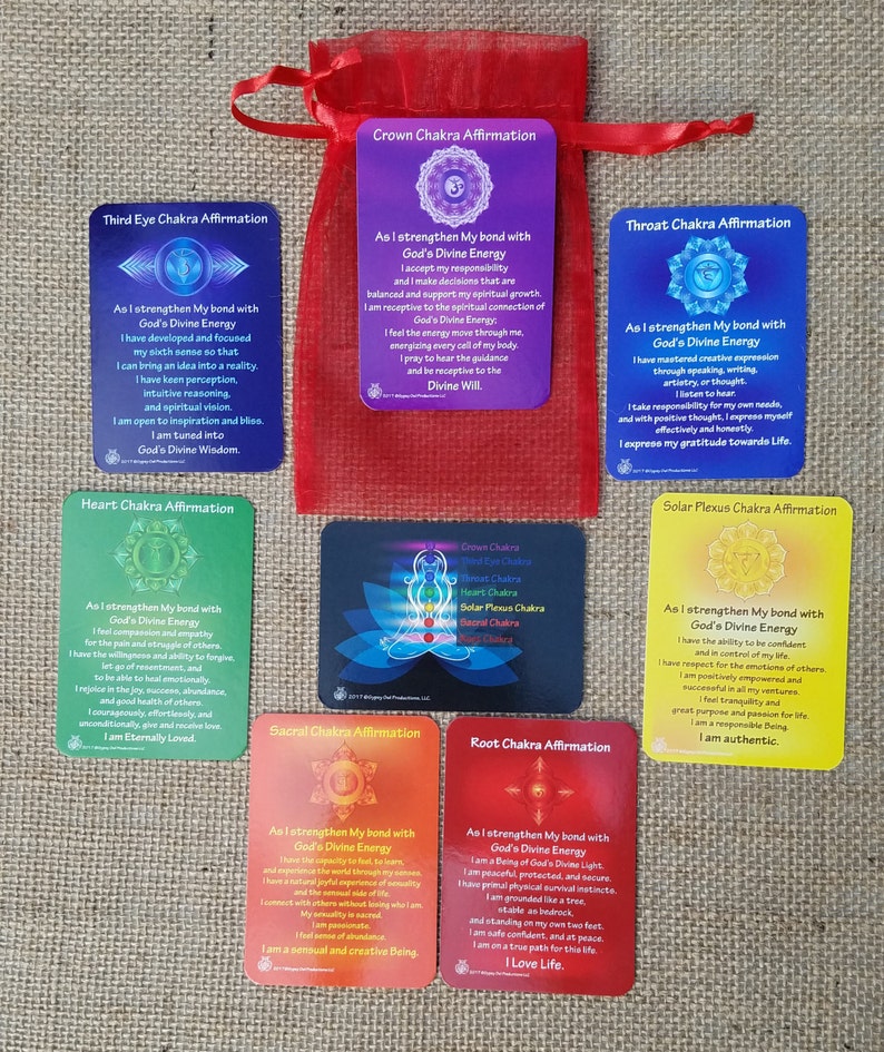 May include: Set of seven affirmation cards with colorful backgrounds and illustrations of chakras. Each card features an affirmation related to a specific chakra, such as "As I strengthen My bond with God's Divine Energy, I accept my responsibility and make decisions that are balanced and support my spiritual growth."