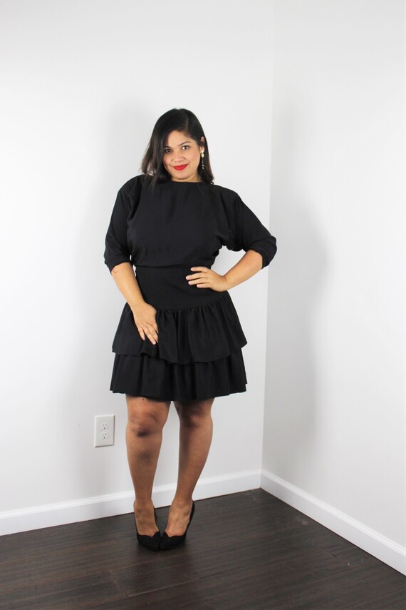 black dress with batwing sleeves