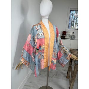 May include: A rustic wooden sign with the text "Welcome to our home" in white lettering. The sign features a distressed finish and a simple, inviting design, perfect for entryway decor.