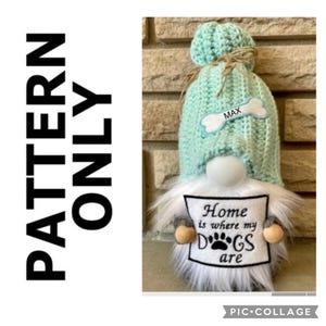 May include: A white gnome with a light blue crocheted hat and a sign that says "Home is where my dogs are". The hat has a bone-shaped tag with the name "Max" on it.