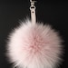 Destiny reviewed Light Pink Fox Fur Keychain Keyring pompom with genuine leather strap