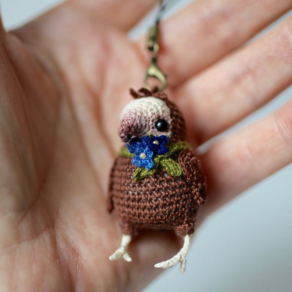 Amigurumi bird, crochet brown bird with green scarf with 3 tiny blue flowers, OOAK