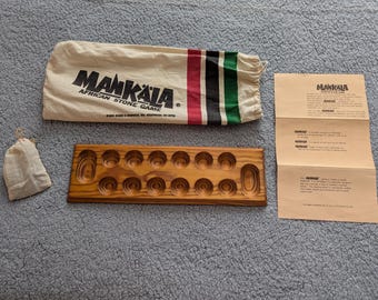 Jogo de pedra africano vintage MANKALA com bolsa e instruções, conjunto completo.