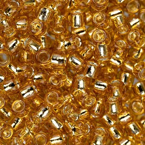 TR-15-22B - TOHO Round Seed Beads Size 15/0  Topaz Silver Lined