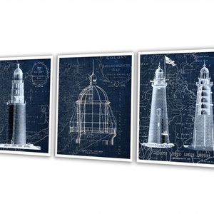 May include: Set of three vintage blueprint style prints of lighthouses. Each print features a different lighthouse design with a map background. The prints are in shades of blue and white.