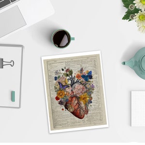 May include: A vintage anatomical heart illustration with colorful flowers and butterflies on a vintage book page background.
