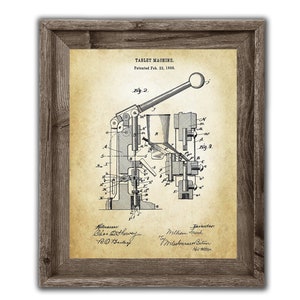 May include: A vintage patent drawing for a tablet machine, dated February 22, 1898. The drawing shows a detailed illustration of the machine's internal workings, including gears, levers, and a hopper. The patent is titled "Tablet Machine" and includes the names of the inventors, William Freck and Mileshmruer Bitur.