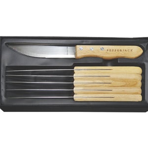May include: A set of six steak knives with wooden handles in a black box. The knives have serrated blades and the handles are engraved with the word "Pepperjack".