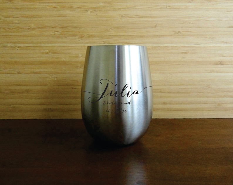 May include: Stainless steel wine tumbler with the name "Julia" and the text "bridesmaid to be" engraved on it.