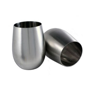 May include: Two stainless steel wine glasses, one is upright and the other is tilted to the side.