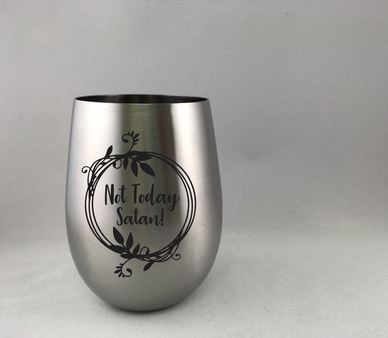 May include: A stainless steel wine tumbler with a black floral design and the text "Not Today Satan!" printed on the side.