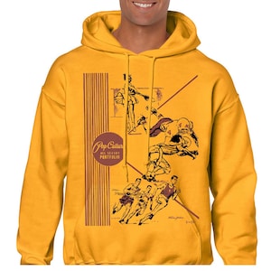 May include: A mustard yellow hooded sweatshirt featuring a graphic print of vintage sports illustrations. The design includes a circular logo with the text Pop Culture All Season Portfolio, alongside depictions of football players and runners.