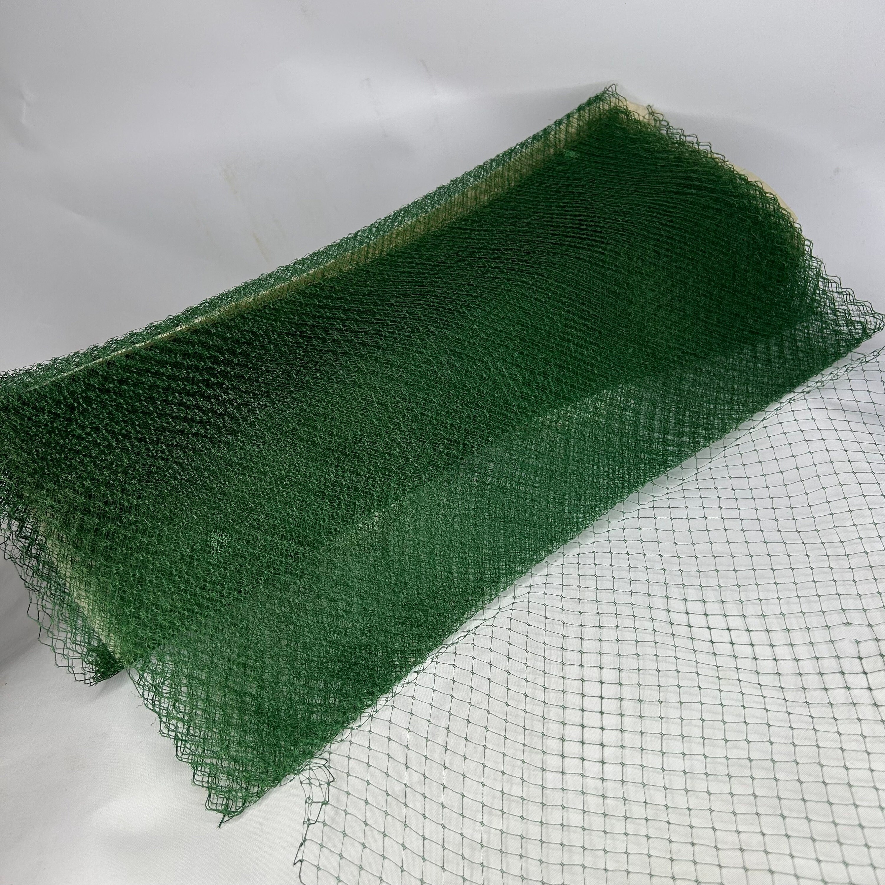 A delicate silk veil drapes across a form