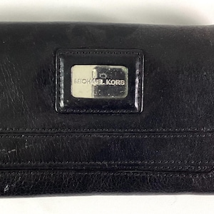 Michael Kors - Cartera de piel negra de tres pliegues