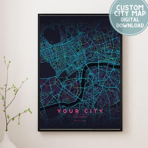 May include: A framed custom city map digital download. The map features a neon blue and purple street grid over a dark background. The text "YOUR CITY" is displayed in pink. A white circle with text reads "CUSTOM CITY MAP DIGITAL DOWNLOAD".