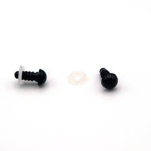 May include: Two black plastic safety eyes with a white plastic washer. The eyes are about 1 cm in diameter.