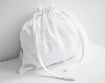 Linen drawstring bag. Linen underwear storage bag in pure white.