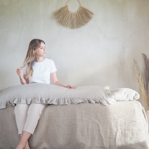 Linen body pillow pillowcase in natural linen. Pillowcase for a long pillow with a ruffle.