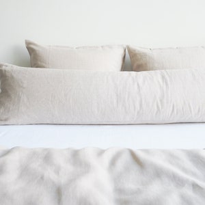 Linen body pillow pillowcase in natural linen. Pillowcase for a long pillow made from 100% stonewashed linen.