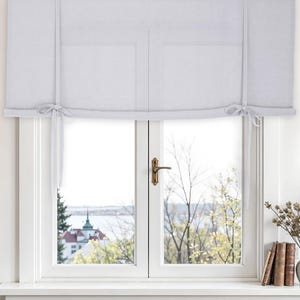 Linen tie up curtain. Tie up blind made of linen. Window shades