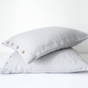 Light gray linen pillowcase with coconut buttons. Linen pillow cover