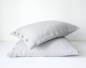 Light gray linen pillowcase with coconut buttons. Linen pillow cover