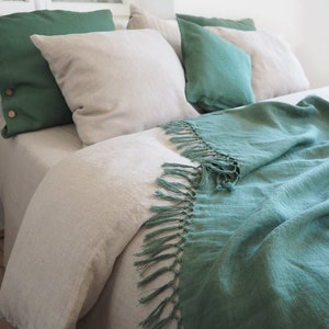 green blanket with fringes