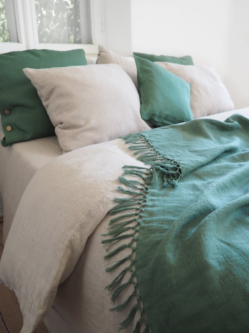 green blanket with fringes