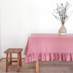 Dusty pink ruffled tablecloth made of stonewashed linen. custom size