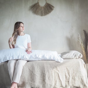 Linen body pillow pillowcase in pure white. Pillowcase for a long pillow with a ruffle.