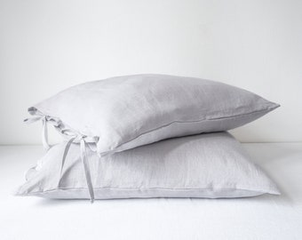 Light gray linen pillowcase tied with a bow, linen pillow cover