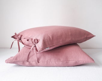 Dusty pink pillow cover tied with a bow. made of 100% european linen. stonewashed. handmade in poland.