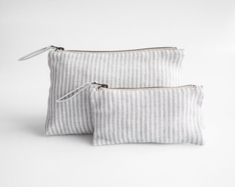Linen travel pouch. sustainable linen makeup bag in gray stripes color.