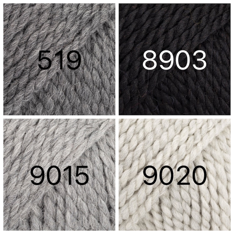 May include: Four skeins of yarn in different colors: gray, black, light gray, and white. The yarn is chunky and has a textured look. The skeins are labeled with the numbers 519, 8903, 9015, and 9020.