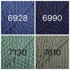 May include: Four yarn skeins in different colors: a dark blue, a navy blue, a teal green, and a gray green. Each skein has a number printed on it: 6928, 6990, 7130, and 7810.