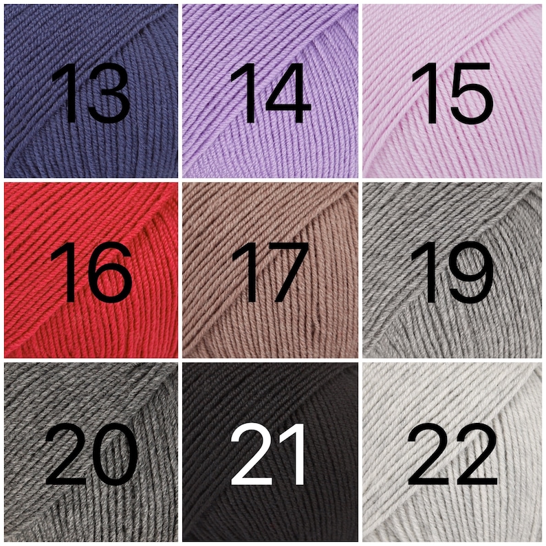 May include: Nine balls of yarn in different colors, numbered 13 through 22. The yarn is arranged in three rows of three balls each.